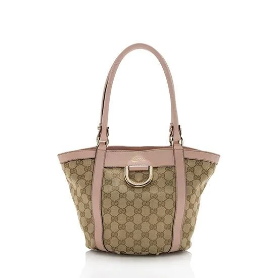 Women Gucci bags with a snap - button closure and a decorative charmGucci GG Canvas D-Ring Tote