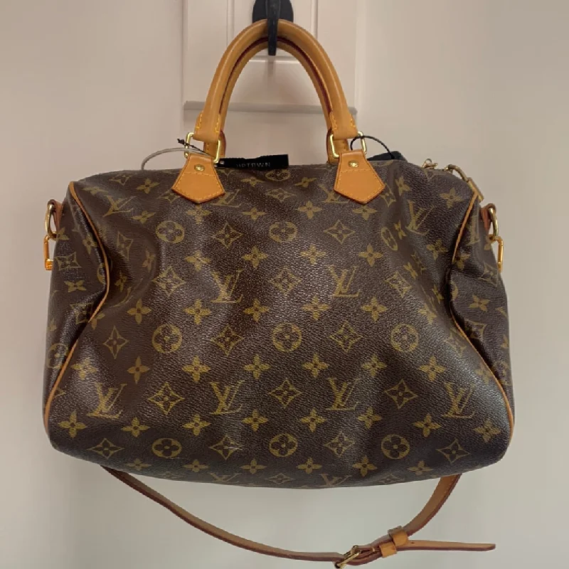 Louis Vuitton bags with a chain - link trim and a leather body for a modern edgeLouis Vuitton Monogram Bandouliere 30