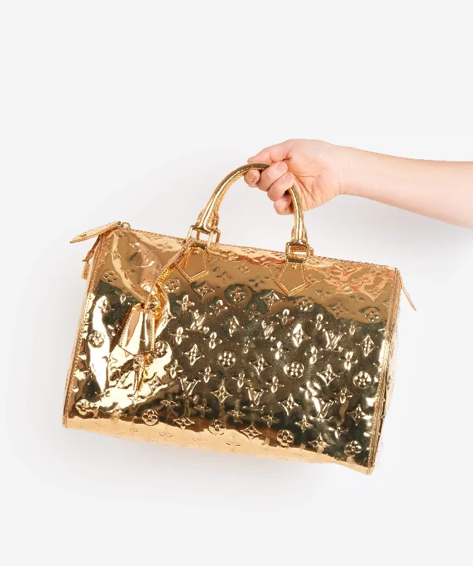 Louis Vuitton bags with a chain - link trim and a leather body for a modern edgeLOUIS VUITTON Monogram Gold Mirror Speedy 35