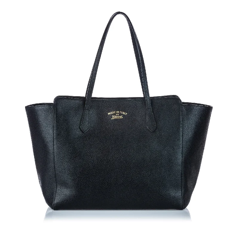 Women Gucci bags with a snap - button closure and a decorative charmGucci Black Others Leather Swing Tote Bag Italy