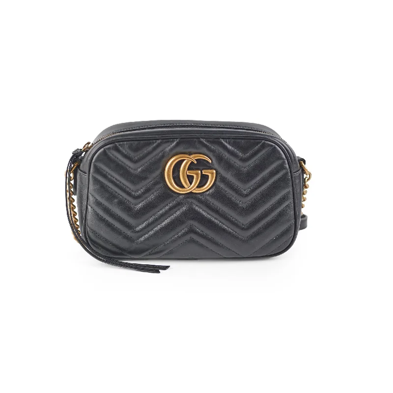 Women Gucci Sylvie bags with a monogram - embossed leatherGucci Small Marmont Camera Black Bag