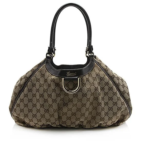 Ladies Gucci Dionysus bags in a pastel colorGucci GG Canvas Abbey D-Ring Tote