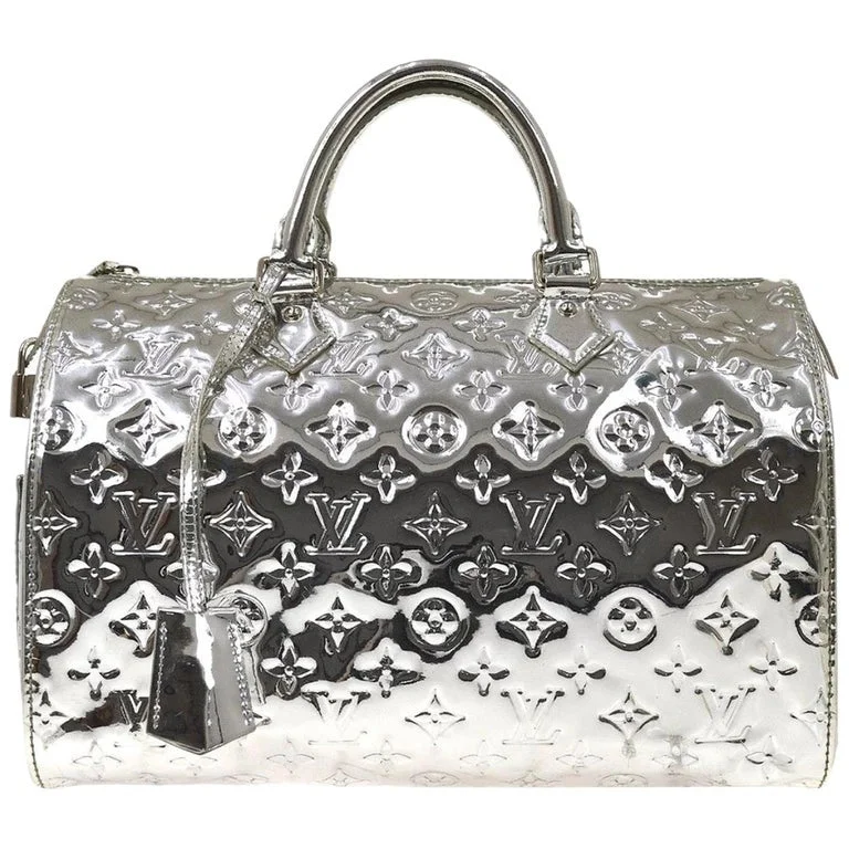 Louis Vuitton bags with a chain - link trim and a leather body for a modern edgeLouis Vuitton Monogram Speedy 35 Handbag