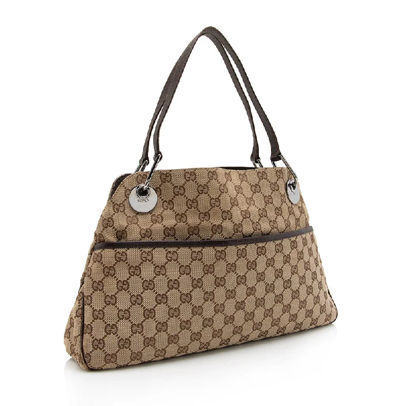 Women Gucci bags with a zippered interior pocketGucci GG Canvas Eclipse Medium Shoulder Bag (16635)