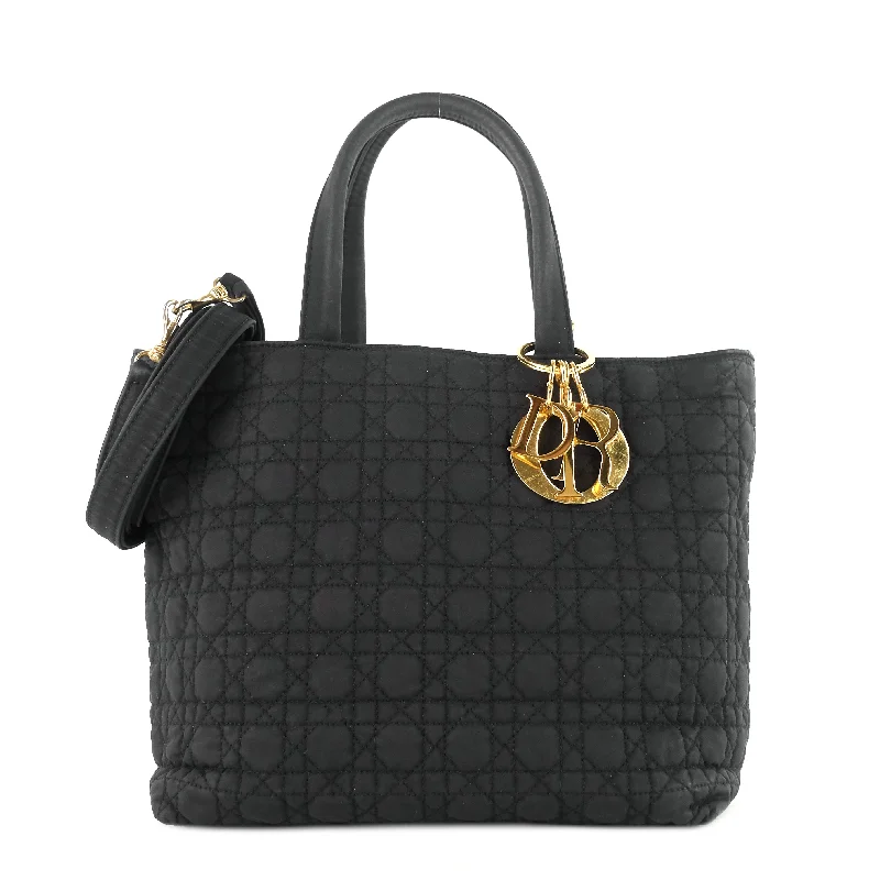 Christian Dior handbags with a snap - button closure and a decorative buckleCannage Nylon Bag