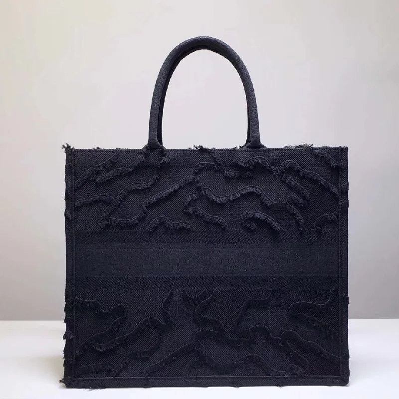 Christian Dior handbags with a snap - button closure and a decorative buckleChristian Dior Book Tote Bag In Black Camouflage Embroidered Canvas